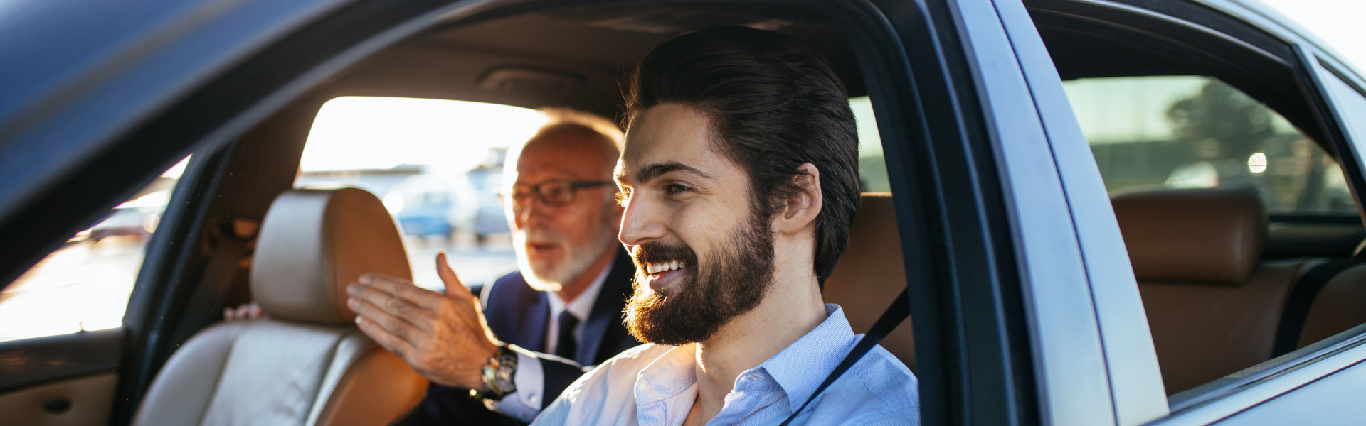 driver and passenger smiling